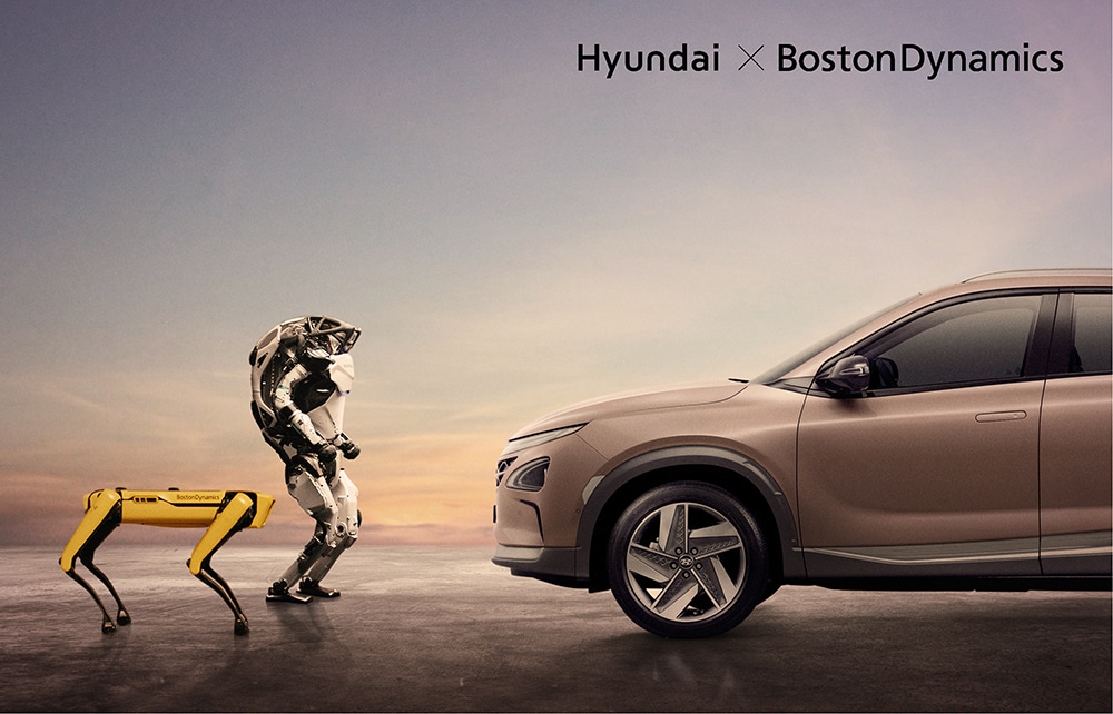 Spot and Atlas facing a Hyundai car
