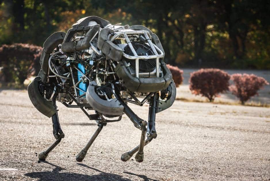 Wildcat robot runs across a paved surface outside