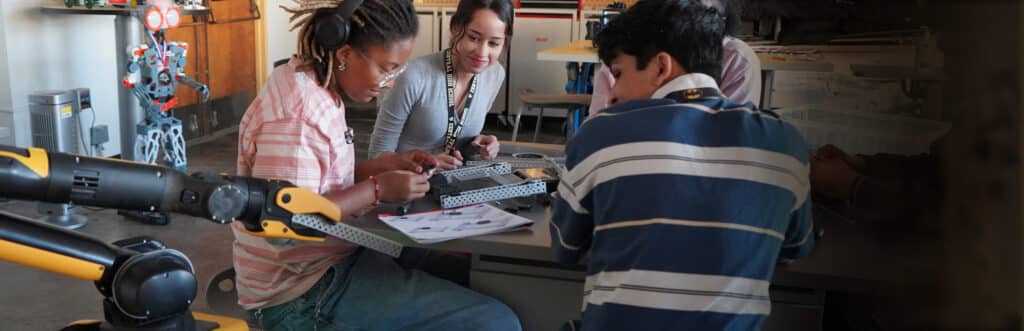 Spot in a classroom with several high school students