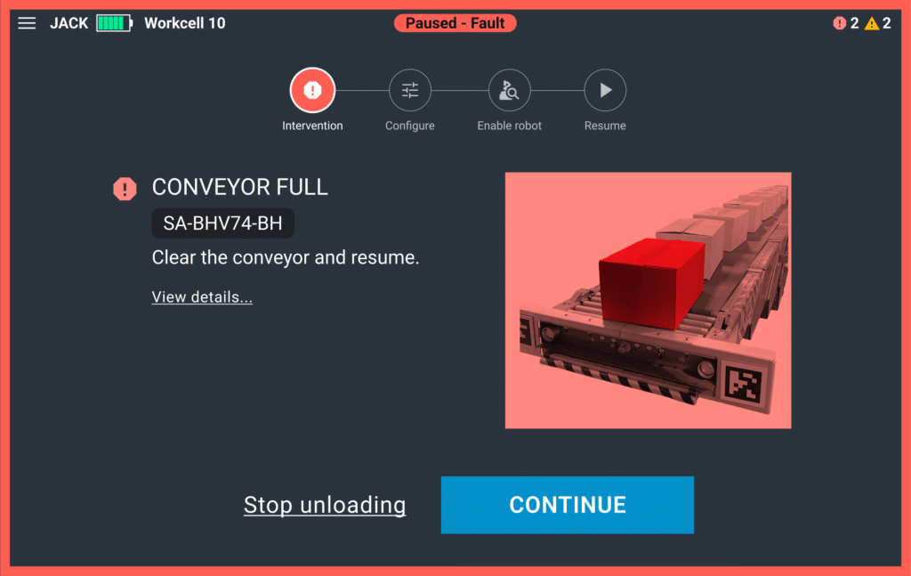 A troubleshooting screen shows boxes backed up on a conveyor belt with instructions on how to proceed.