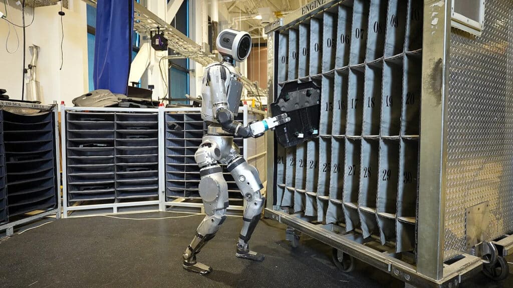 Atlas places an engine cover onto a dolly