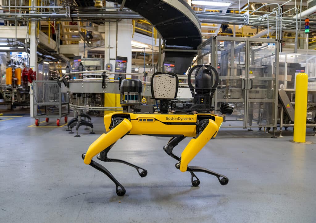 Spot walks through a packaging facility