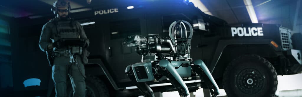 Spot stands in front of police officers
