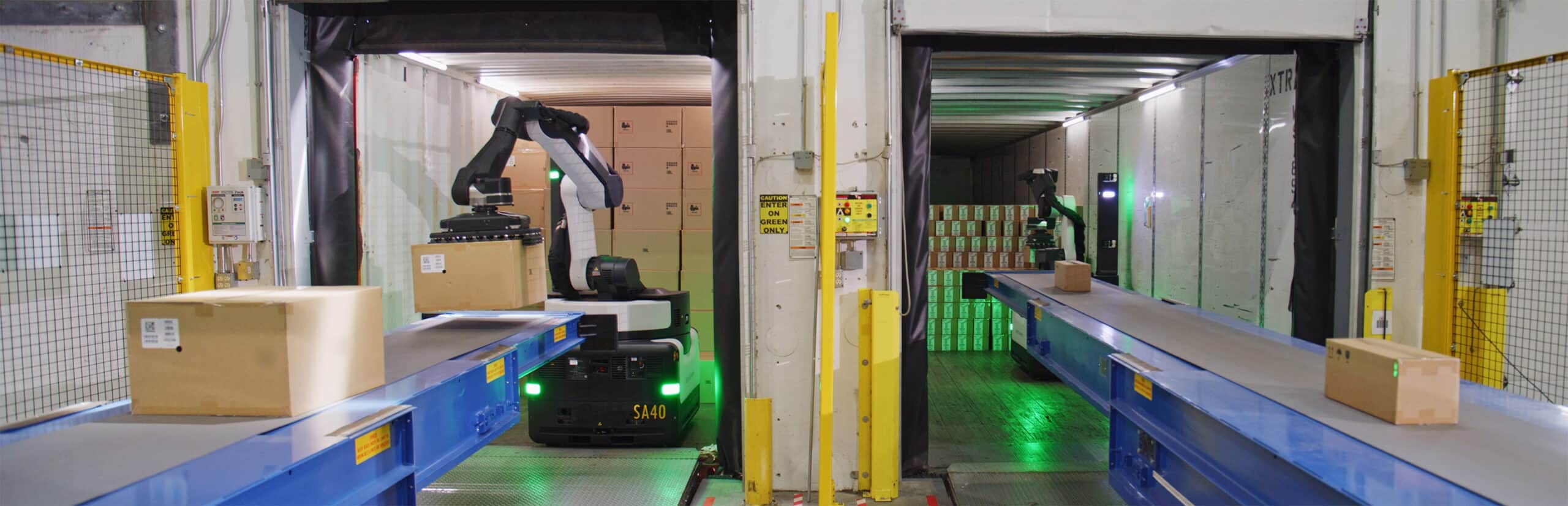 Two Stretch robots working in a warehouse