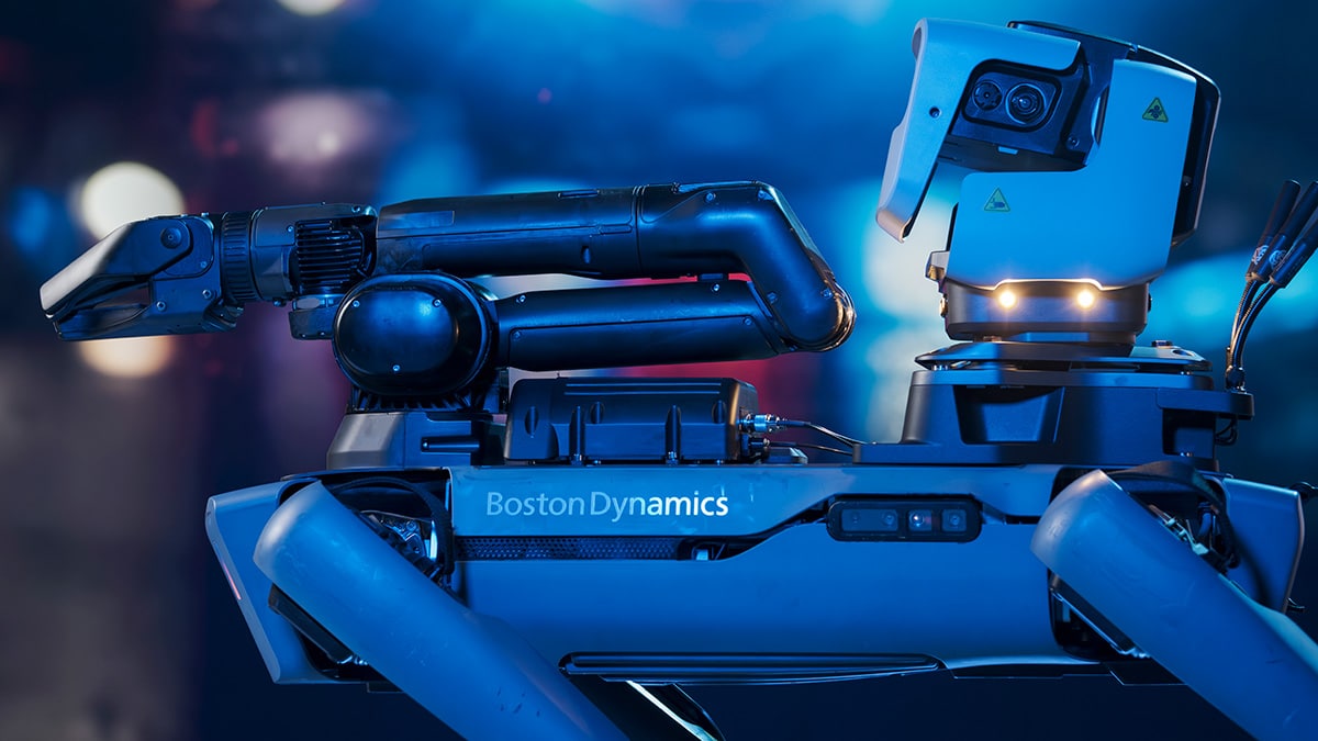 Spot robot in a dark environment with sensing payload and manipulator arm